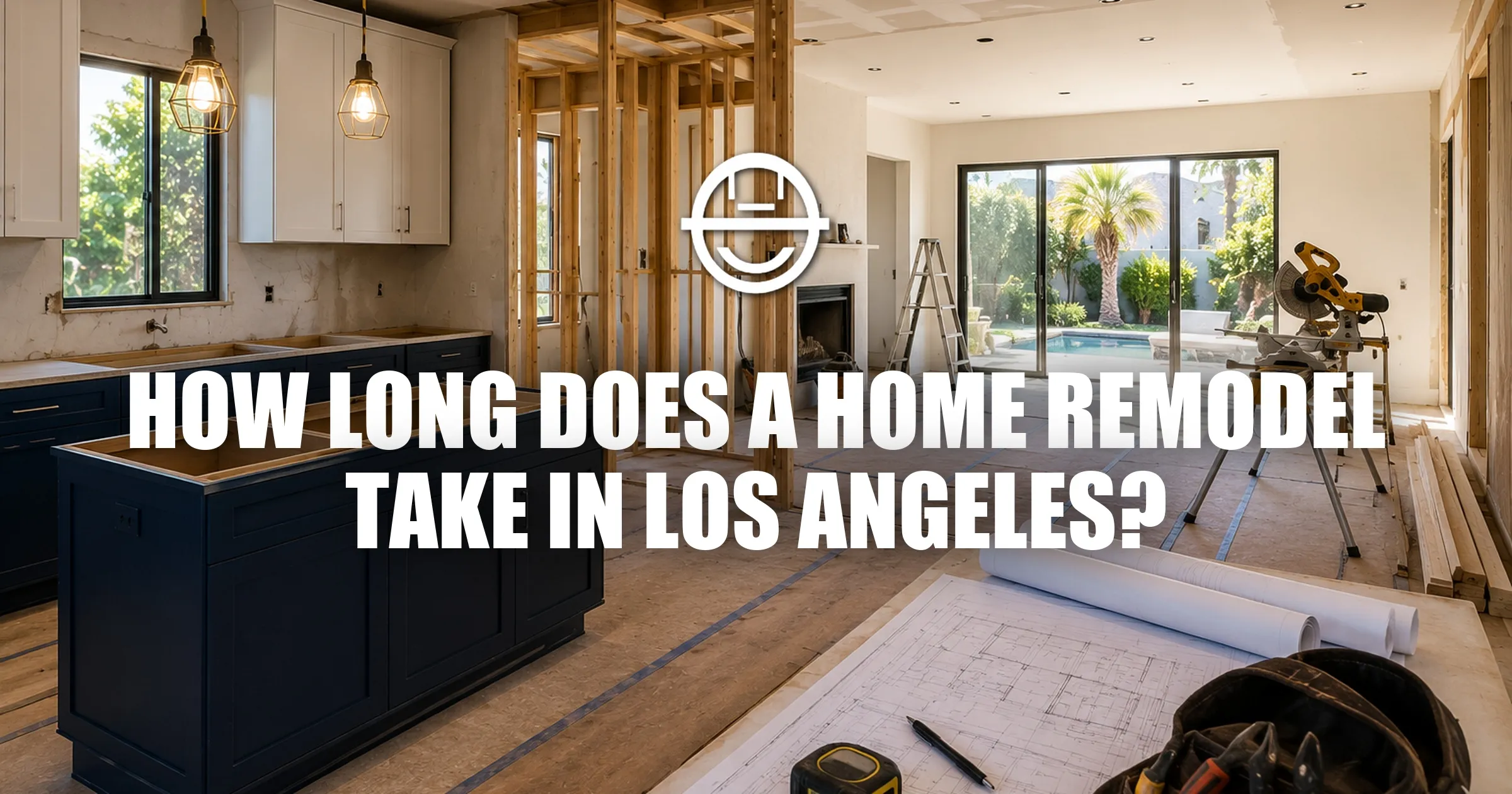 Open-concept Los Angeles home undergoing renovation with unfinished kitchen, exposed framing, construction plans, and natural light throughout the space.
